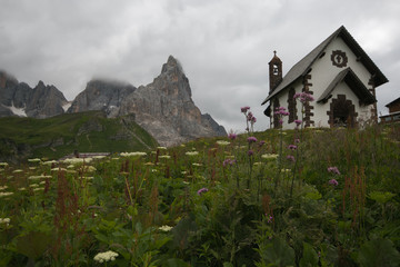 View of little church with Pale di San Martino in the background, Passo Rolle, Italian Dolomites