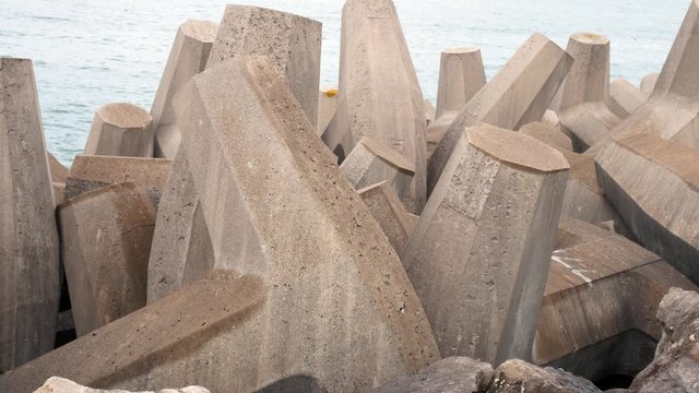 Many concrete formed coastline defence geometric shape engineering on shoreline