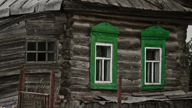 An old rickety wooden house in an abandoned Russian village.