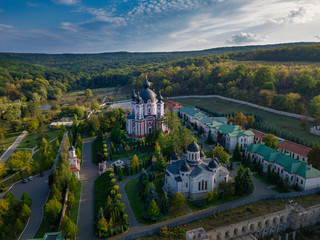 Flight over a christian monastery surrounded by autumn forest. Kurky monastery, Moldova republic of. © Igor Syrbu