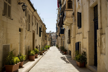 Fototapeta na wymiar A quaint narrow street in Valletta, Malta