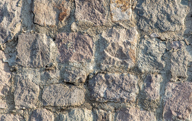 Wall of stone blocks as an abstract background
