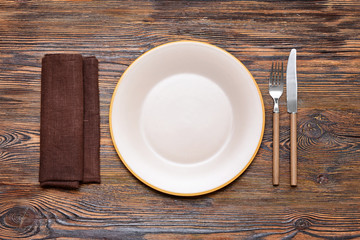 Simple table setting on wooden background