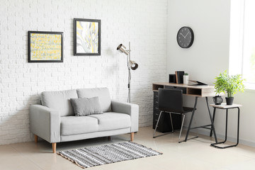 Stylish interior of living room with sofa and table - obrazy, fototapety, plakaty