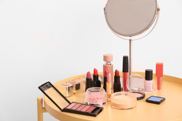 Makeup cosmetics on table in dressing room