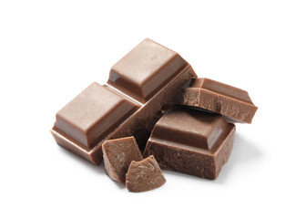 Pieces of delicious milk chocolate isolated on white