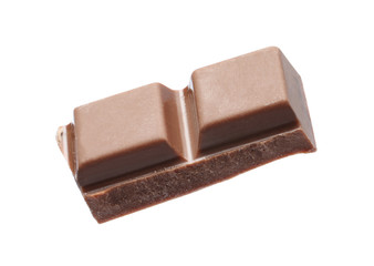 Piece of delicious milk chocolate isolated on white