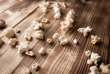 Popcorn flakes on a wooden background