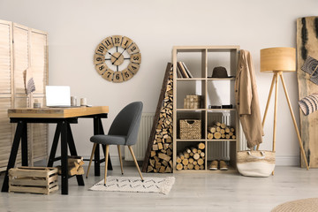 Fototapeta na wymiar Stylish room interior with firewood as decorative element
