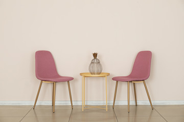 Chairs with table in empty room