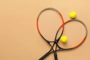 Foto op Canvas Tennis rackets with balls on color background © Pixel-Shot