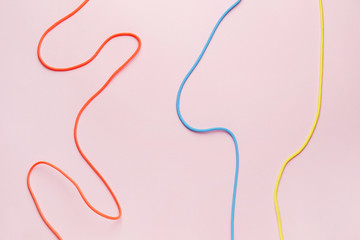 Long ropes on color background