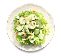 Plate with tasty cucumber salad on white background