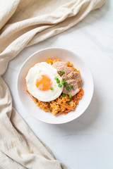 Kimchi fried rice with fried egg and pork