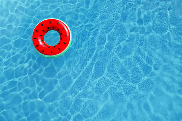Swimming pool with inflatable ring, top view. Space for text