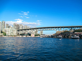 Granville Bridge, boats and houses in Vancouver at summer.
