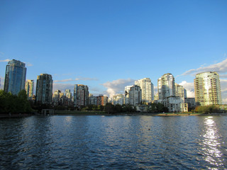 Naklejka premium Sea and apartment buildings in Vancouver at summer.