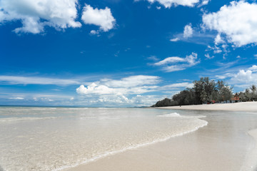 Turquoise blue sea with white sand and sunny sky in summer with copy space