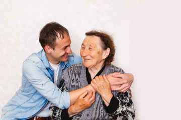 Closeup of elderly woman with young man
