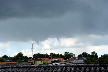 Severe weather system with tornado over the city.  This tornado did not cause damage.