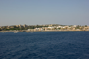 Fototapeta premium Greece. Rhodes island. Rest at the sea. Euro-trip. Sea water surface. Mountains in the background.
