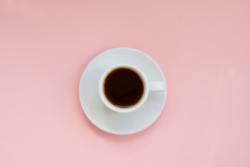 White cup of strong coffee on pink background Copy space
