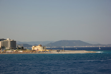 Fototapeta premium Greece. Rhodes island. Rest at the sea. Euro-trip. Sea water surface. Mountains in the background.