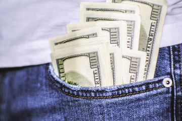 A wad of hundred-dollar bills sticks out of my pocket. A well-paid job.