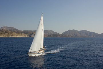 Fototapeta na wymiar Greece. Rhodes island. Rest at the sea. Euro-trip. Sea water surface. Boats.