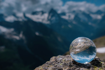 beautiful spherical glass ball with majestic Caucasian mountains