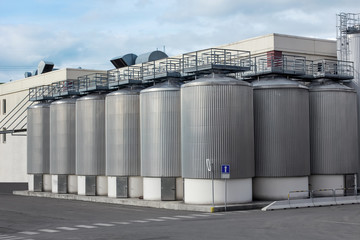Brewery tanks blue sky big containers beer production industry © Caribbean Blue