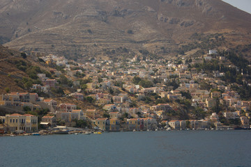 Obraz premium Greece. Rhodes island. Rest at the sea. Euro-trip. Sea water surface. Mountains in the background.