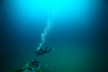 Fototapeta na wymiar shipwreck diving landscape under water, old ship at the bottom, treasure hunt