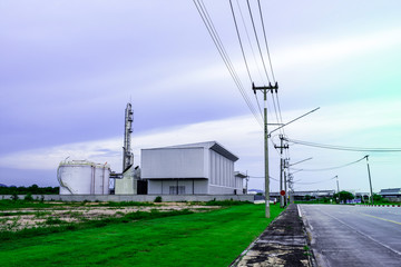 Fototapeta na wymiar Industrial factory with sunset sky
