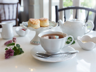 Breakfast tea set with fresh cookies, butter, jam. Good morning.