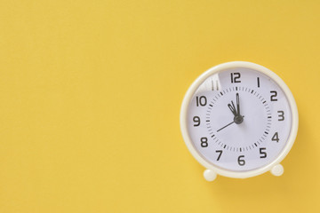  White clock on a yellow background