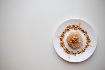 turkish sweet dessert named kunefe on white background