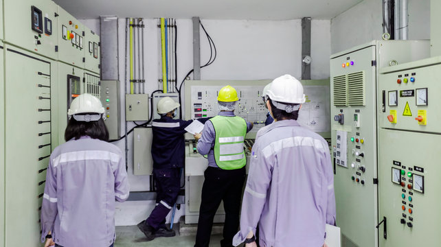 Engineers are in control room for high voltage electricity of factory, Safety patrol in manufacturing area, Cooperation by engineer and technician to check abnormality in factory