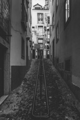 Vertical view of narrow old alleyways of Alfama neighborhood in Lisbon, Portugal