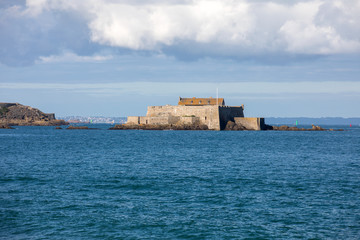  View of the Fort National in Saint Malo a tidal island in the English Channel at high tide. Brittany, France