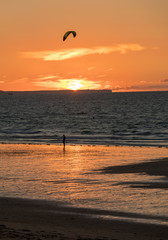  Sunset and Kitesurfers on the beach in Saint Malo,  Brittany, France