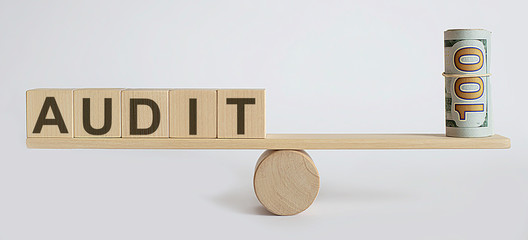 Seesaw Showing Balance Between money And word AUDIT