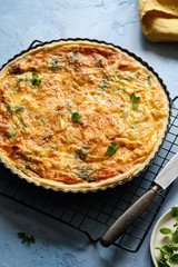 Quiche with ham and cheese. Open pie.