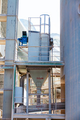 Mynaral, Kazakhstan: Jambyl-Cement plant. Grey metal ventilation equipment (dust filter).