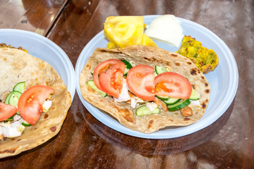 healthy breakfast vegetables and meat on a tortilla