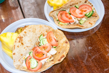 healthy breakfast vegetables and meat on a tortilla