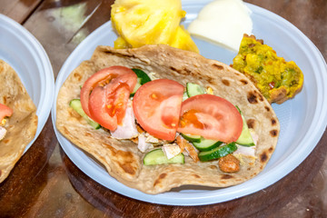 Fototapeta na wymiar healthy breakfast vegetables and meat on a tortilla