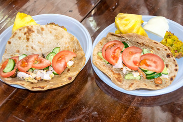healthy breakfast vegetables and meat on a tortilla