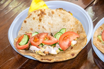 healthy breakfast vegetables and meat on a tortilla