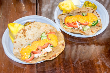 healthy breakfast vegetables and meat on a tortilla